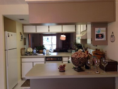 kitchen breakfast bar and view to LR