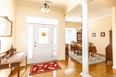 charming foyer with hardwood floors