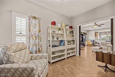 Living area with a ceiling fan and recessed lighti