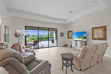 Living area with light tile patterned floors, base