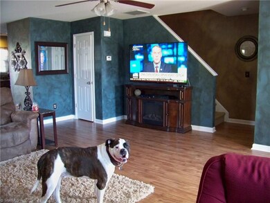 Brand new laminate flooring looks great with the custom faux finish! (Sorry, Mack doesn't come with the house!)