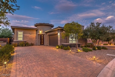 Prairie-style home with an attached garage, a tile