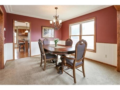 The formal dining room is conveniently located rig