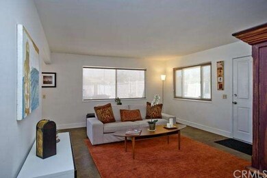 Living room with large, sunny windows
