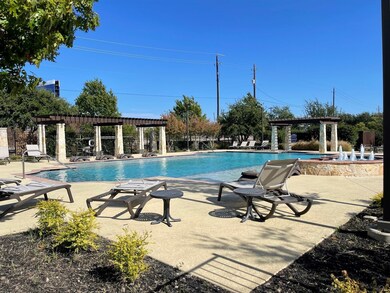View of swimming pool featuring a patio and a perg
