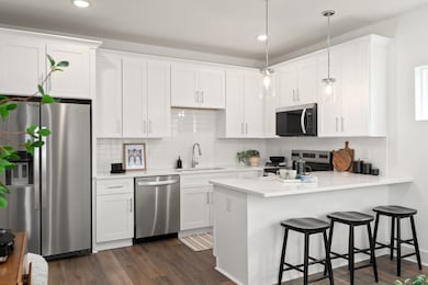 All stainless steel appliances included. photos of similar model and not of actual home.