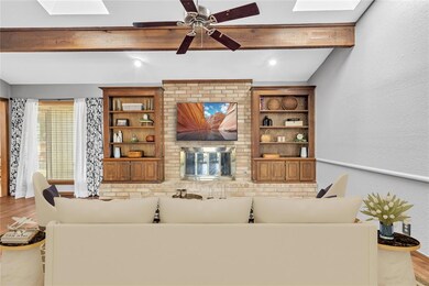 Living room featuring lofted ceiling with beams, w