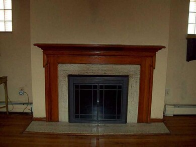 Living Room. WOOD BURNING FIREPLACE IN LIVING ROOM
