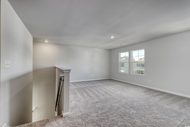 Unfurnished living room featuring light colored ca