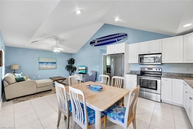 Living room and kitchen are open to one another.