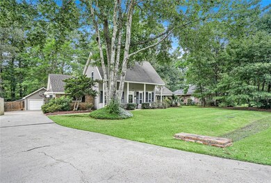 Extra long driveway with rear entry gate.