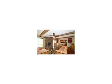 Beamed Great Room opens to kitchen, patio & long g