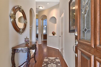 Wood floor entry with leaded glass door ~