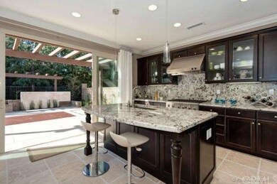 Kitchen w/wide open sliding glass door to back yar