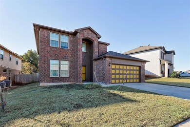 View of front facade featuring a front lawn and a 