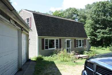 Front; Kitchen on left, Living Room...