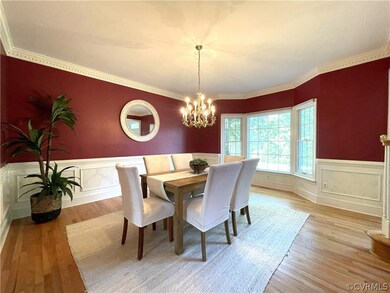 Dining space with light hardwood / wood-style floo
