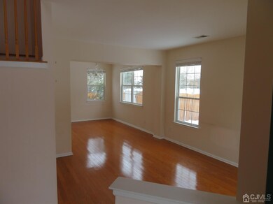 View from front door, living and dining room. Hard