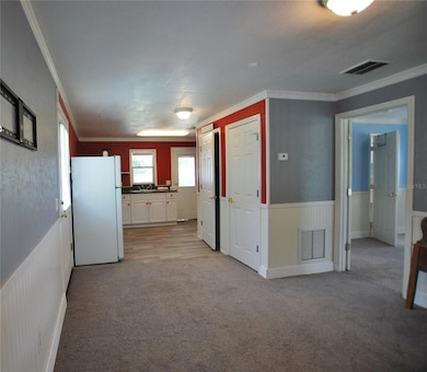 Formal Dining Room off Living Room with Kitchen at Back.