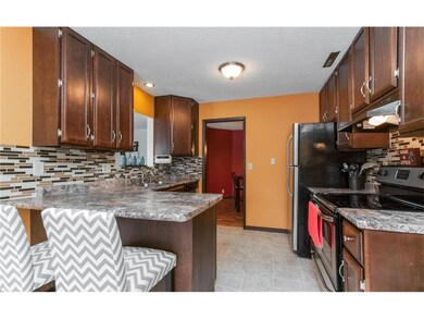 Bright updated kitchen with door to formal dining 