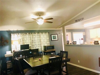 Dining with vaulted ceiling, overlooking kitchen