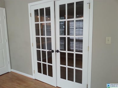 BETWEEN DEN AND SUNROOM