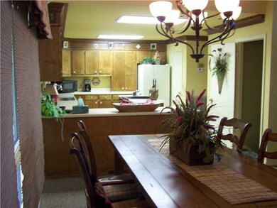 Kitchen/dining combo flows into the vaulted Great 