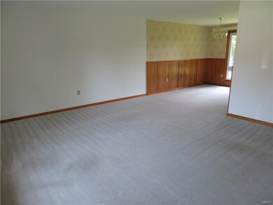 Another angle of the living room into the dining room space.