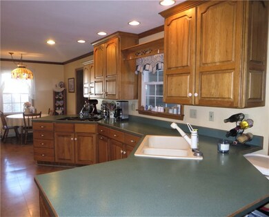 Long open kitchen with eat-in area