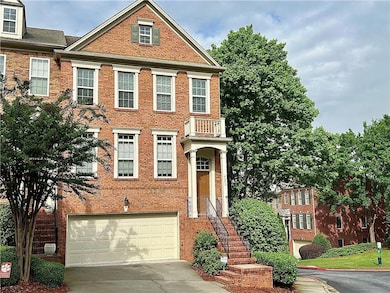 View of property with concrete driveway, brick sid