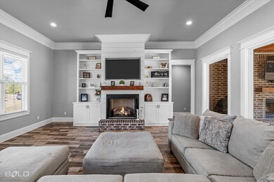 Living room featuring wood-style tile flooring, a 