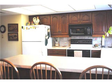 Kitchen offers gorgeous wood cabinets, tile backsp