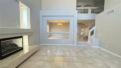 Unfurnished living room with tile patterned floors