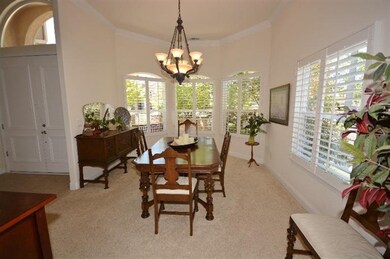 The formal dining room with beautiful windows