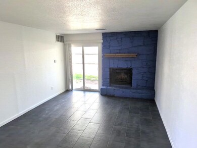 Unfurnished living room with visible vents, a fir