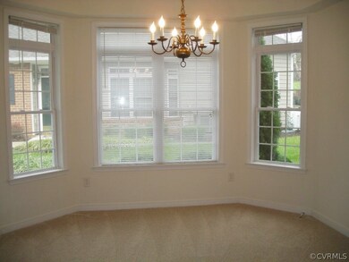 Dining room has new carpet and paint, trey ceiling, crown moldings and bay window.  Great place to entertain.
