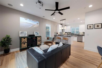 Living room with ceiling fan, recessed lighting, 