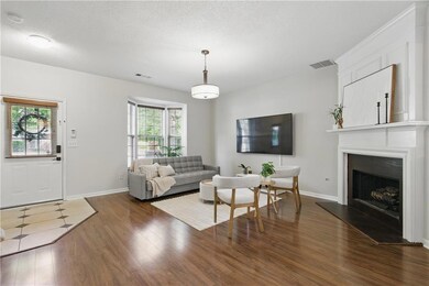 Living room featuring dark wood-type flooring, a f