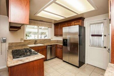 Remodeled Kitchen Has Granite Counter Tops & Stail