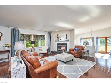 family room with fireplace and bay window