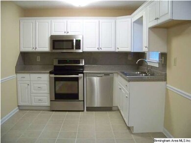 Kitchen with stainless steel stove and dishwasher