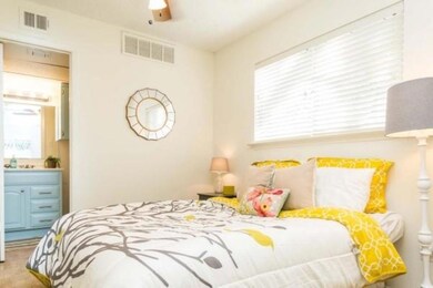 Bedroom with visible vents and ensuite bathroom