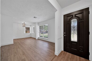 The Foyer Features a New Low-E Entry Door Offering Both Beauty and Privacy. The Formal Living Flows to the Formal Dining and into the Kitchen. New Luxury Vinyl Plank is Installed Throughout this Beautiful Home.
