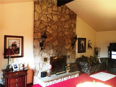 The living room boasts this beautiful floor to cei