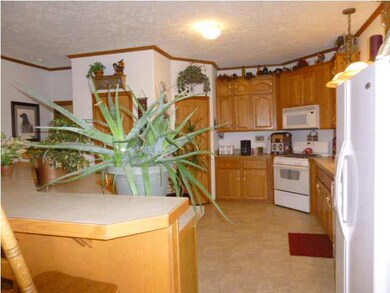 Kitchen with pantry and lots of cabinets and bar s