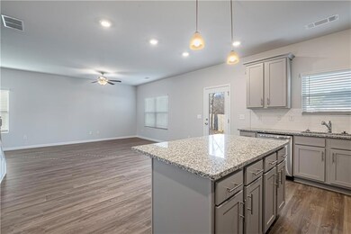 Kitchen featuring a center island, dark wood-type 