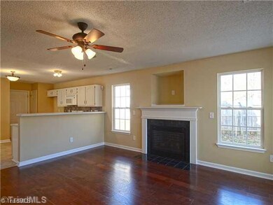 Living Room. The living room is open to the kitchen which makes for easy entertaining.