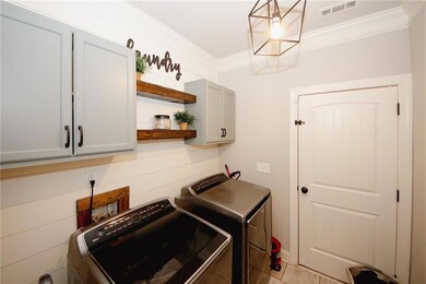 Laundry room with independent washer and dryer, vi