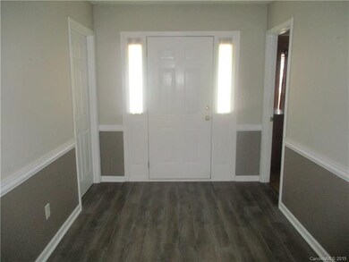 Large foyer of this split bedroom designed ranch h