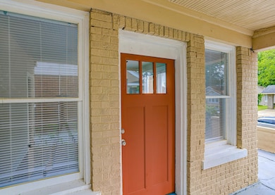 Entrance to property with brick siding